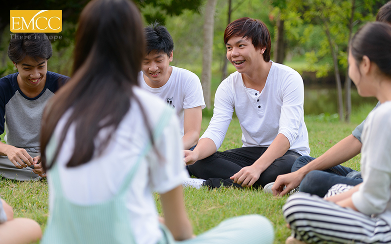 Group of teenagers engaging comfortably in youth counselling session