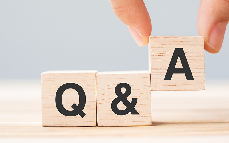 Q and A acronym on a wooden cube