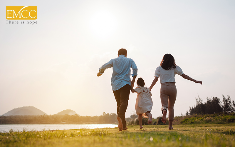 happy family catching the sunset in the park